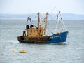 Small fishing trawler moored at sea