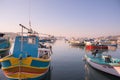 Marsaxlokk, Malta, August 2019. Dawn over the bay with Maltese boats. Royalty Free Stock Photo