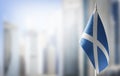 A small flag of Scotland on the background of a blurred background Royalty Free Stock Photo