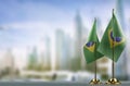 Small flags of the Brazil on an abstract blurry background Royalty Free Stock Photo
