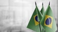 Small flags of the Brazil on an abstract blurry background Royalty Free Stock Photo
