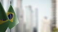 Small flags of the Brazil on an abstract blurry background Royalty Free Stock Photo