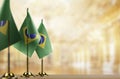 Small flags of the Brazil on an abstract blurry background Royalty Free Stock Photo