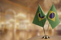 Small flags of the Brazil on an abstract blurry background Royalty Free Stock Photo
