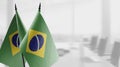 Small flags of the Brazil on an abstract blurry background Royalty Free Stock Photo