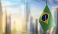 Small flags of the Brazil on an abstract blurry background Royalty Free Stock Photo