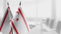 Small flags of the Northern Cyprus on an abstract blurry background