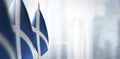 Small flags of Scotland on a blurry background of the city Royalty Free Stock Photo