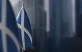 Small flags of Scotland on a blurry background of the city Royalty Free Stock Photo