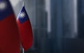 Small flags of Taiwan on a blurry background of the city Royalty Free Stock Photo