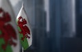 Small flags of Wales on a blurry background of the city Royalty Free Stock Photo