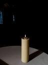 a candle burning in a church Royalty Free Stock Photo