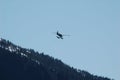 Small float plane flying over Alaska mountains Royalty Free Stock Photo