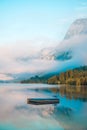 Small floating pier on lake Bohinj surface in summer morning Royalty Free Stock Photo