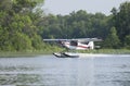 Small floatplane lands on a Minnesota lake Royalty Free Stock Photo