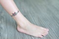 Small flower tattoo sticker on child ankle, Dress up tattoos