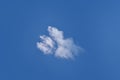 Small, fluffy and lonely clouds in the blue sky. Royalty Free Stock Photo
