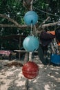 Foam ball buoy for fishing net float hanging on tree under bright sunny day Royalty Free Stock Photo