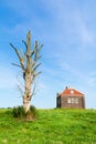 Small foghorn house in harbour of former island Schokland, Netherlands