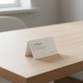 A small, folded business card labeled \