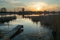 A small footbridge on the shore of a lake and sunset Royalty Free Stock Photo