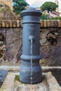 A small fountain of fresh and clean water for drinking on one of the streets of Rome in Italy. Classic Roman fountain with Royalty Free Stock Photo