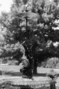 Small fountain woman with an umbrella