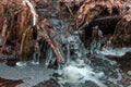 A small freezing waterfall in a winter Park. Royalty Free Stock Photo
