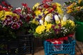 small fresh bouquets at the flower market in plastic boxes