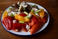 Small fresh red and yellow peppers with mushrooms and spring onions Royalty Free Stock Photo