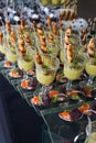 Fresh and tasty snack dishes in glasses, caviar served with micro green and salad, celebration party banquet, gourmet food fashion