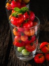 Small fresh tometo in the glass. Royalty Free Stock Photo