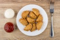 Small fried chebureks in plate, bowls with sauces and fork Royalty Free Stock Photo