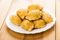 Small fried chebureks in white plate on table Royalty Free Stock Photo