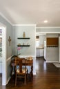 Small front area of house cut out made into a home office with hardwood floors