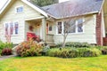 Small front porch with red bench Royalty Free Stock Photo