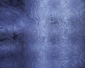 Small frosty patterns on glass in blue tone Royalty Free Stock Photo