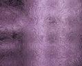 Small frosty patterns on glass in violet tone Royalty Free Stock Photo