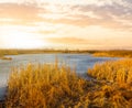 Frozen lake among prairie at the sunset Royalty Free Stock Photo