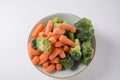 Small frozen pieces of broccoli and carrots. Healthy food.