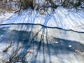 Frozen river covered with ice during sunny winter day Royalty Free Stock Photo