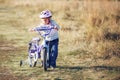 Small funny kid with bike Royalty Free Stock Photo