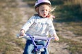 Small funny kid riding bike