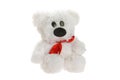 Small funny teddy bear with red bow toy isolated at white background. Stuffed puppet animal