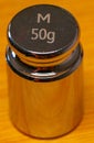 small 50g weight in cylindrical shape for calibrating precision scales