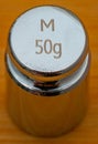 small 50g weight in cylindrical shape for calibrating precision scales