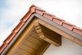 Small gable at the front facade. Roof covered with red tiles