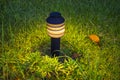 Small Garden Lamp on surrounded grass field