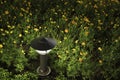 Small Garden Lamp on surrounded yellow daisy flowers