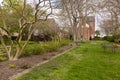 A small garden with trimmed shrubs, beautiful flowering plants and trees Royalty Free Stock Photo